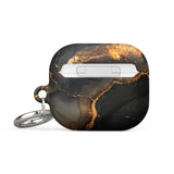A sleek, black Midnight Volcano Marble for AirPods Gen 3 case with a gold marbling design and a metallic keychain ring attached. Featuring an elegant and artistic appeal, the case also includes a robust metal carabiner for convenience. The bottom boasts "STATEMENT CASES" in white lettering, combining style with impact-absorbing material for added protection by Statement Cases.