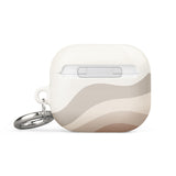 A Serene Sands for AirPods Gen 3 case decorated with wavy beige and light brown stripes. It features a metal carabiner for easy attachment, and the words "Statement Cases" are printed on the lower front. Designed with impact-absorbing material, it ensures your AirPods stay protected in style.