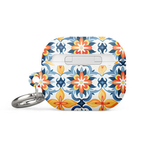 A rectangular AirPods case with a metal carabiner attachment, featuring an impact-absorbing design and a vibrant floral and geometric pattern in blue, orange, yellow, and white colors reminiscent of traditional tile designs. The brand name "Statement Cases" is printed on the bottom. This is the Mediterranean Bloom for AirPods Gen 3.