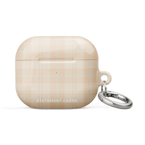 A beige plaid Sophisticated Plaid for AirPods Gen 3 by Statement Cases with a metallic keyring attachment on the right side. Made from premium impact-absorbing material, the case features a light blue and white checkered pattern. The bottom front displays the text "STATEMENT CASES" in white capital letters.