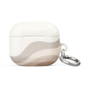 A Serene Sands for AirPods Gen 3 case decorated with wavy beige and light brown stripes. It features a metal carabiner for easy attachment, and the words "Statement Cases" are printed on the lower front. Designed with impact-absorbing material, it ensures your AirPods stay protected in style.