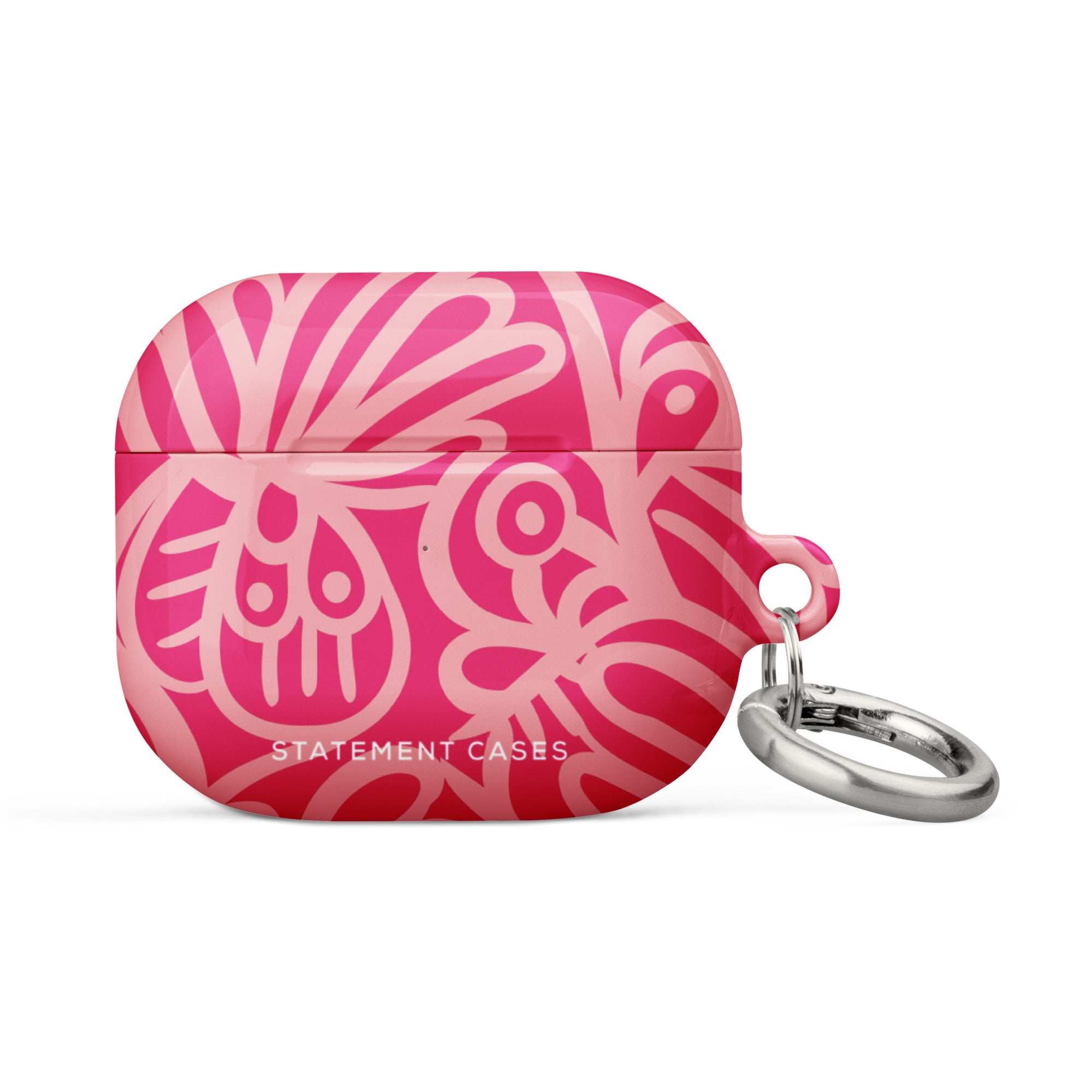 Introducing the Zafiro Rosa for AirPods Gen 3 by Statement Cases: a pink and red abstract-patterned protective case made from impact-absorbing material, featuring a small silver keychain attached to its side. The text "STATEMENT CASES" is prominently printed on the front near the bottom.