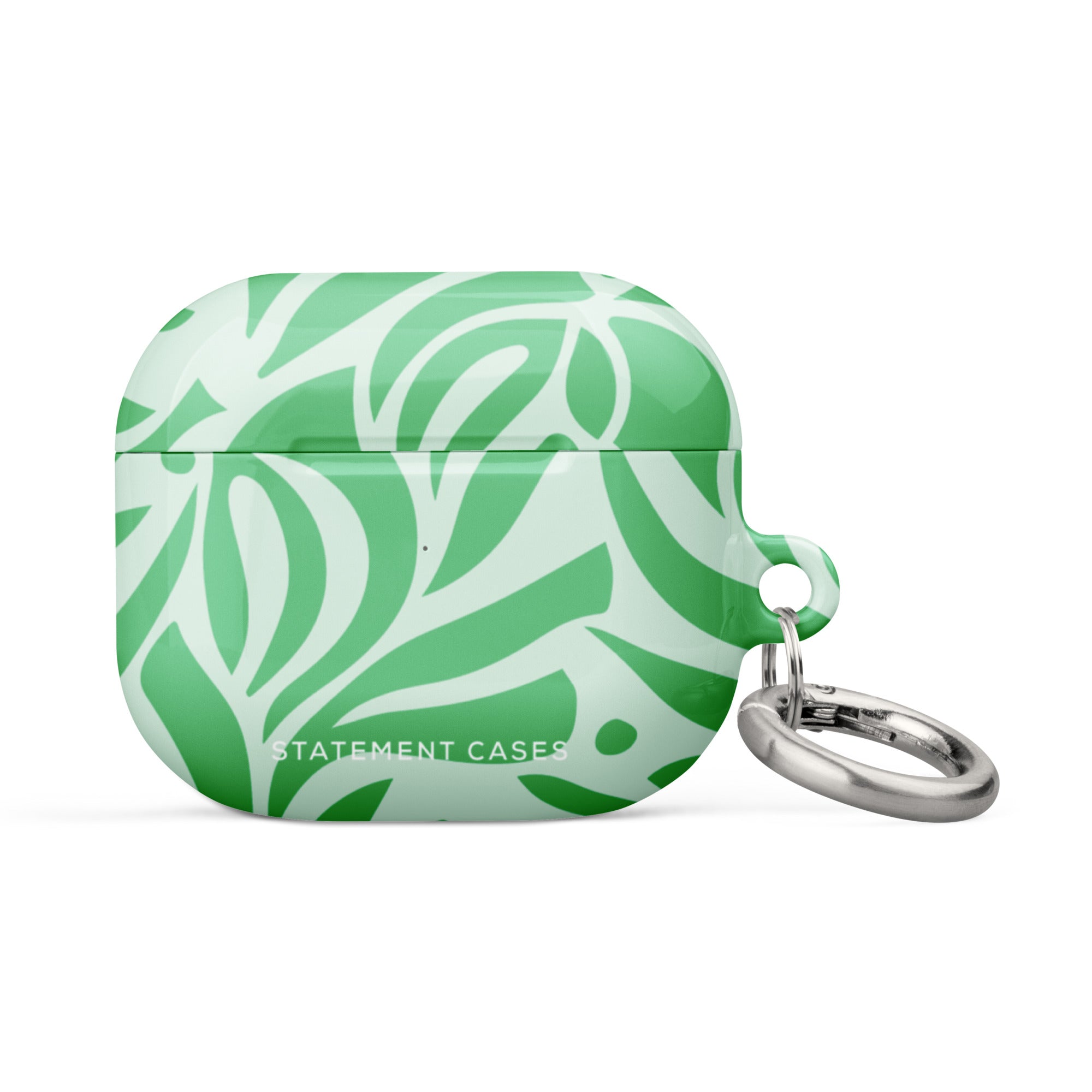 Introducing the Selva Verde for AirPods Gen 3 by Statement Cases, a green and white patterned case featuring a bold, abstract leaf design. The case is inscribed with "STATEMENT CASES" in white at the bottom and boasts an impact-absorbing build complete with a silver metal carabiner on the right side.