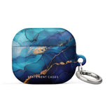 The Midnight Wave Marble for AirPods Gen 3 by Statement Cases is a stylish, impact-absorbing case that features a vibrant blue and gold marbled design with "Statement Cases" printed on the front. It also comes with a sturdy metal carabiner for easy attachment.