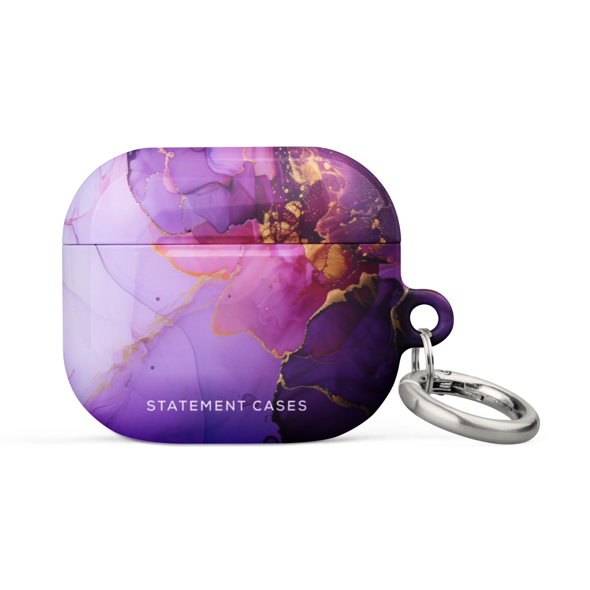 Introducing the "Golden Orchid Marble for AirPods Gen 3" from Statement Cases—a stylish AirPods case featuring a luxurious purple marble design accented with gold veins. This impact-absorbing case is embossed with the "STATEMENT CASES" logo at the bottom and comes equipped with a metal carabiner attached to the side, making it easy to carry or attach to other items.