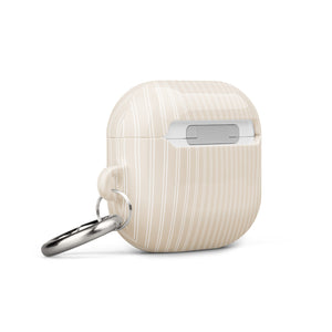 A beige, impact-absorbing Noble Pinstripe for AirPods Gen 3 by Statement Cases with white vertical stripes. It features a small, polished metal carabiner attached to the right side for convenience. The text "STATEMENT CASES" is inscribed at the bottom center of the case.