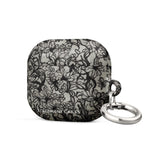 Omerta Floral for AirPods Gen 3 with a black floral lace pattern on a white background, featuring an impact-absorbing material and a metal keyring attachment. The words "STATEMENT CASES" are printed at the bottom.