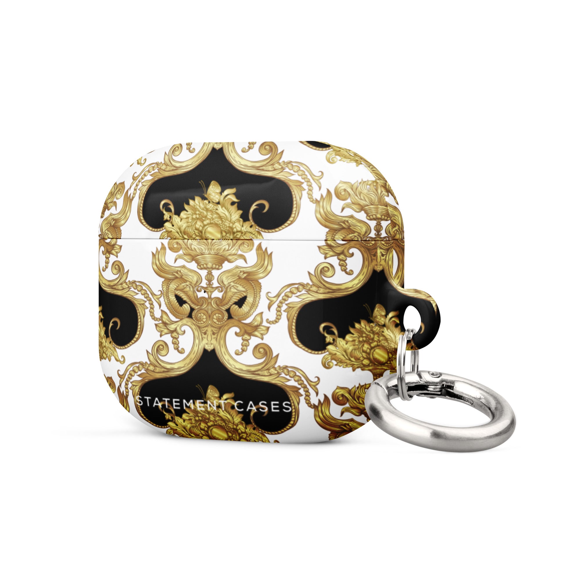 A white Rebellious Spirit for AirPods Gen 3 case by Statement Cases with an elegant black and gold baroque pattern and an attached silver metal carabiner. The impact-absorbing case features intricate golden designs, and the text "Statement Cases" is written on the front.