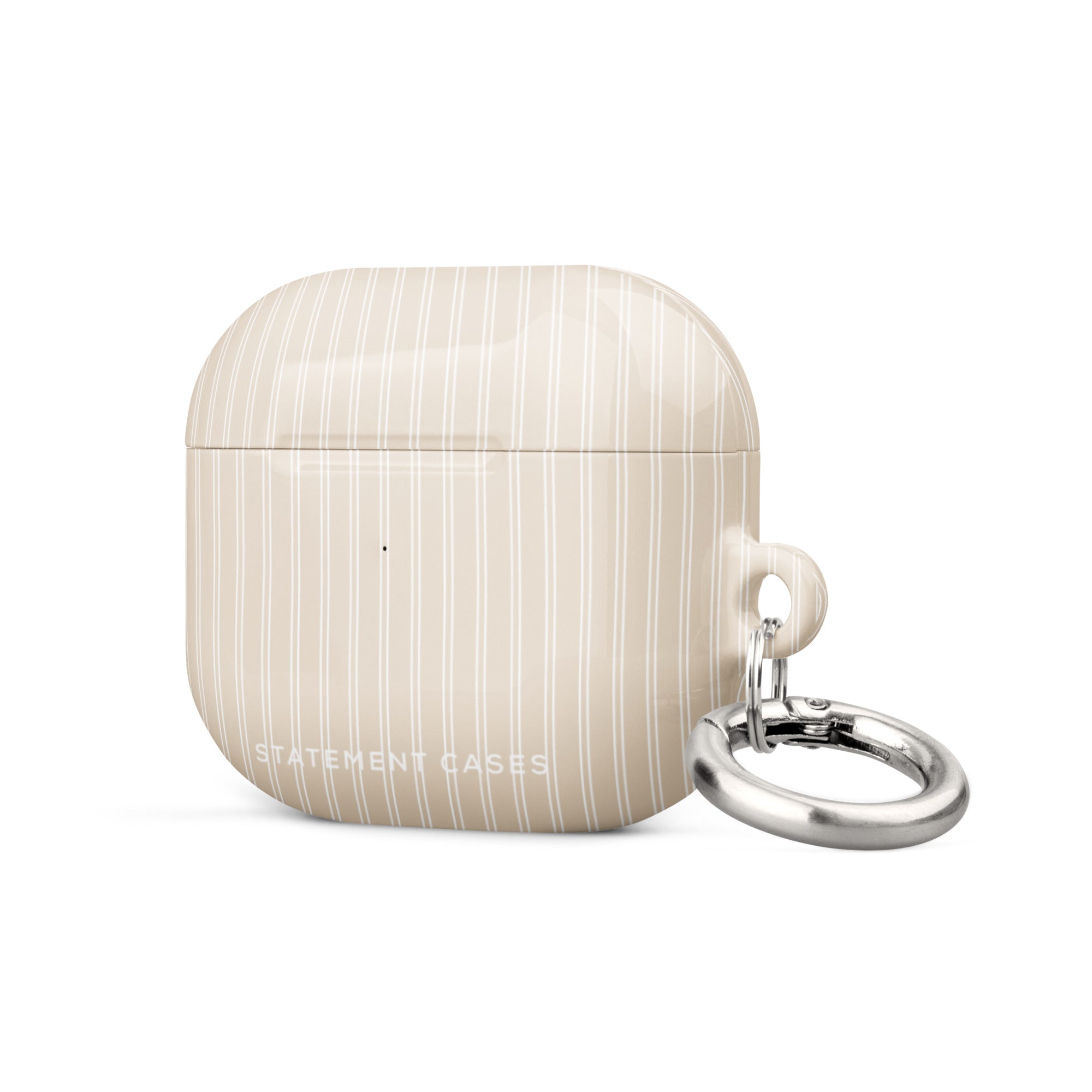 A beige, impact-absorbing Noble Pinstripe for AirPods Gen 3 by Statement Cases with white vertical stripes. It features a small, polished metal carabiner attached to the right side for convenience. The text "STATEMENT CASES" is inscribed at the bottom center of the case.