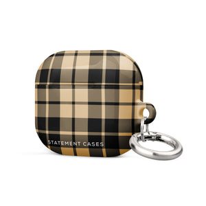 A plaid-patterned, impact-absorbing AirPods case in shades of beige, black, and brown. The Rich Espresso Tartan for AirPods Gen 3 by Statement Cases features a silver metal carabiner attached to its side and the phrase "STATEMENT CASES" printed in white at the bottom.