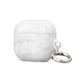 A white, marble-patterned Marble Dreams for AirPods Gen 3 with a metal carabiner attached on the right side for convenience. Made from impact-absorbing material, the case also features "Statement Cases" printed in white at the bottom.