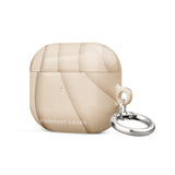 A beige and cream Sandy Serenity for AirPods Gen 3 case with a glossy finish and abstract pattern. The case has "Statement Cases" written in white on the front and features an impact-absorbing design with a metal carabiner attached to the side.