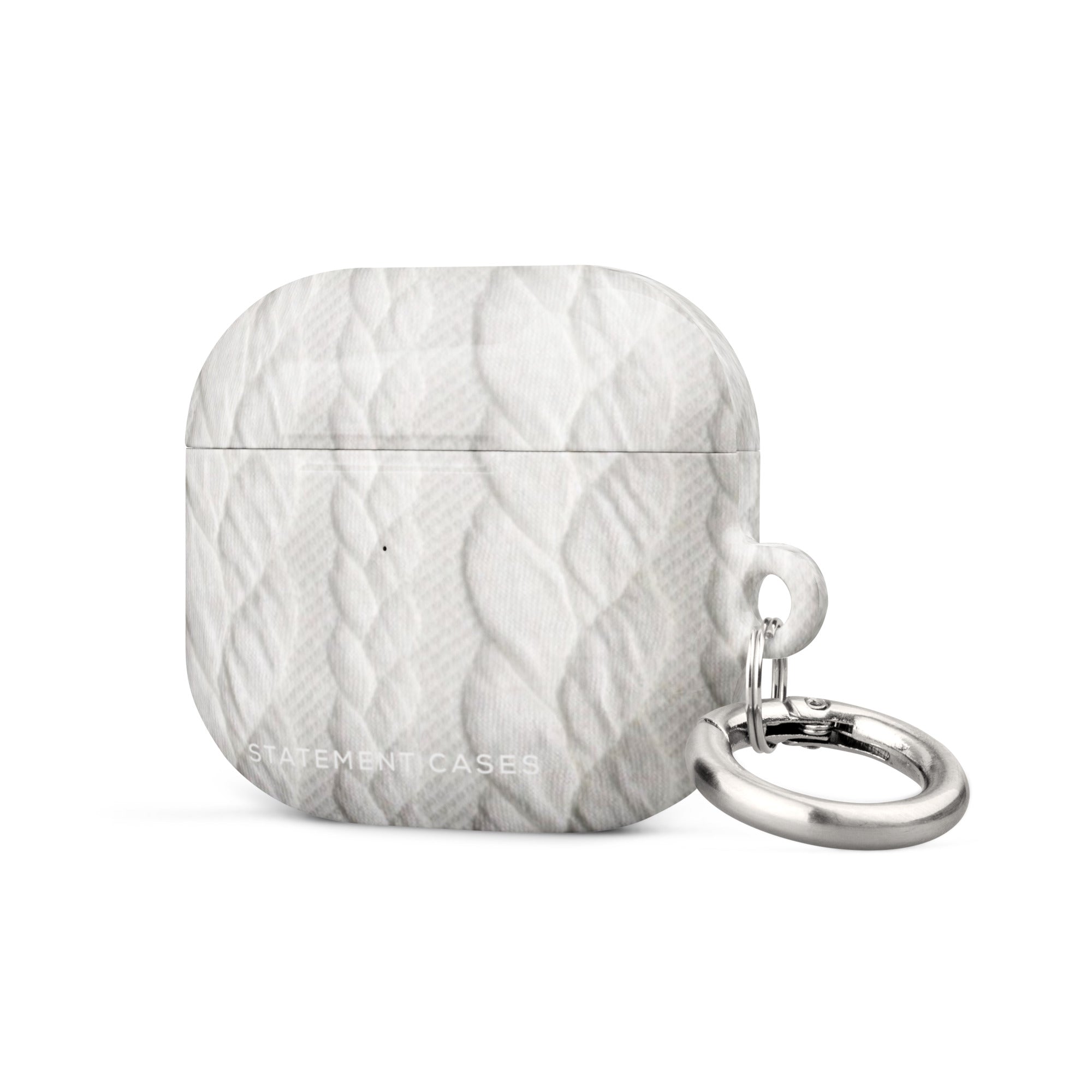 A white, impact-absorbing Cozy Knit Bliss for AirPods Gen 3 case with a knitted texture design and a metal carabiner attached to the side. The brand "Statement Cases" is printed at the bottom, ensuring both style and protection.