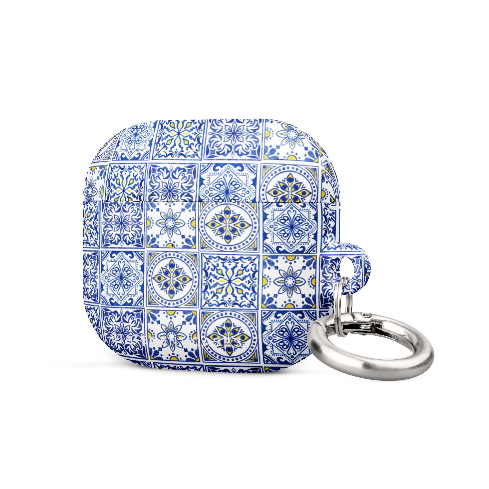 The Lisboa Azul for AirPods Gen 3 by Statement Cases features a rectangular silicon case adorned with a blue and white intricate tile pattern. It comes with a silver metal carabiner on one side, allowing for easy attachment to a bag or keychain, and offers impact-absorbing protection.