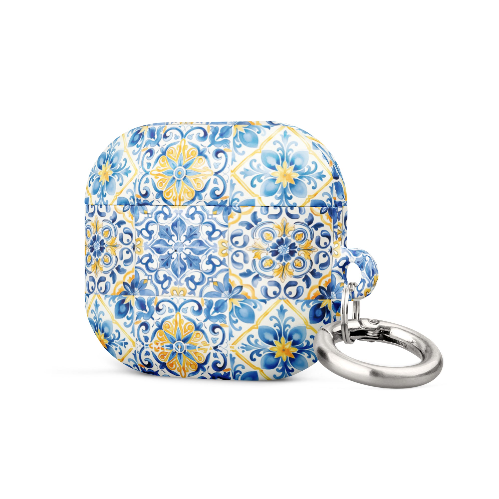 The Blue Mirage for AirPods Gen 3 by Statement Cases is a small rectangular case with rounded edges, adorned with a colorful and intricate tile pattern in blue, yellow, and white. Crafted from impact-absorbing material, the case includes a silver keyring attached to the right side.