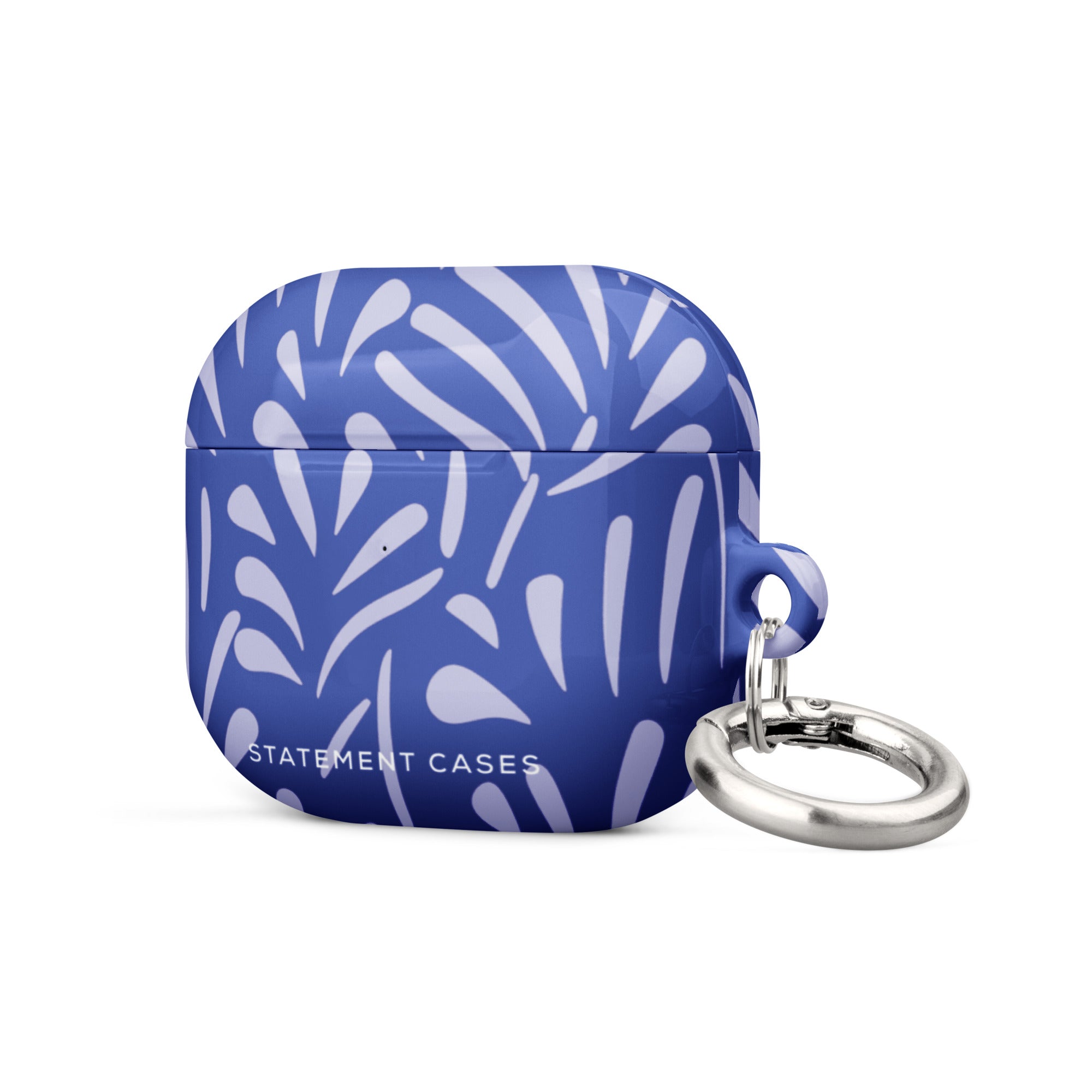 The "Mariposa Azul for AirPods Gen 3" from Statement Cases is a blue protective case for wireless earbuds, featuring an abstract white leaf pattern design. The case has a glossy finish and includes a sturdy metal carabiner attachment on its side. Crafted from impact-absorbing material, the text "STATEMENT CASES" is printed on the front.