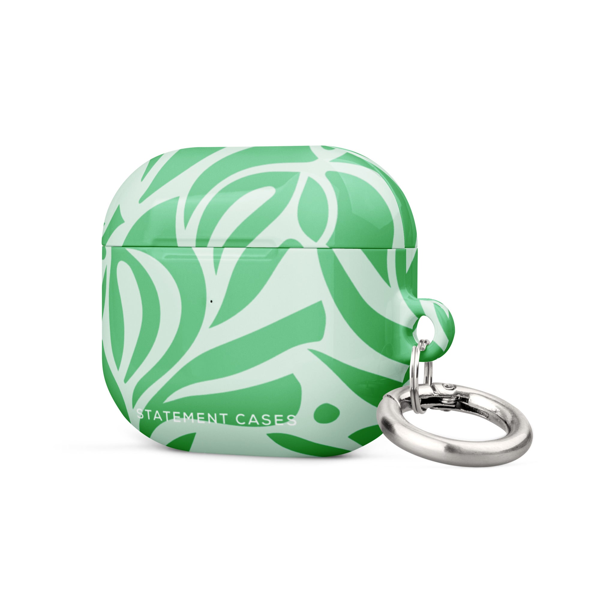 Introducing the Selva Verde for AirPods Gen 3 by Statement Cases, a green and white patterned case featuring a bold, abstract leaf design. The case is inscribed with "STATEMENT CASES" in white at the bottom and boasts an impact-absorbing build complete with a silver metal carabiner on the right side.