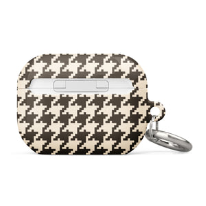 A rectangular Timeless Houndstooth for AirPods Pro Gen 2 with a black and white houndstooth pattern. The case features impact-absorbing material for added protection and has a small metal carabiner attached to the side for easy carrying. The text "Statement Cases" is subtly printed at the bottom center of the case.