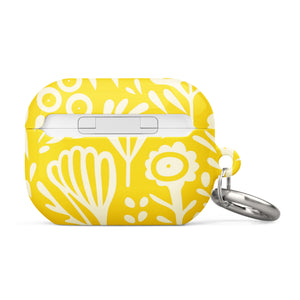 Introducing the Sol Dorado for AirPods Pro Gen 2 from Statement Cases: a yellow AirPods case adorned with a white floral and leaf pattern. This case includes a metal carabiner for easy attachment and is engineered to be impact-absorbing. The brand name "Statement Cases" is printed in small white letters at the bottom center.