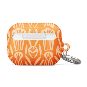 A Savannah Ardiente for AirPods Pro Gen 2 case by Statement Cases, featuring a floral and geometric pattern in lighter orange hues. The phrase "STATEMENT CASES" is printed near the bottom. A metal carabiner is attached to the side of the impact-absorbing case.