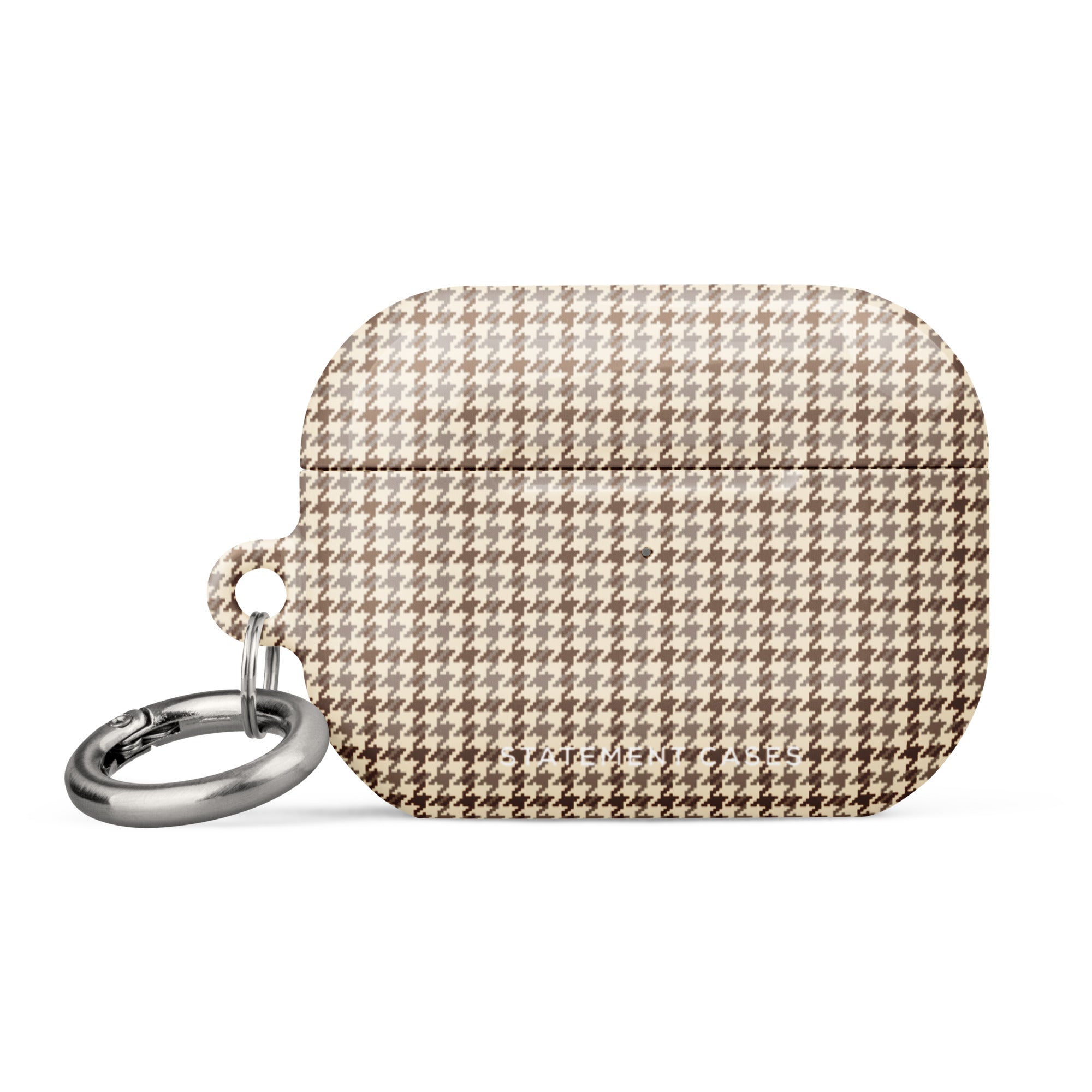 A houndstooth patterned AirPods® case with a metal carabiner attachment on the left side. The case boasts a beige and brown checkered design and features premium impact-absorbing materials for added protection. Introducing the Classic Houndstooth for AirPods Pro Gen 2 by Statement Cases.