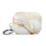 Golden Elegance for AirPods Pro Gen 2 with a marbled design in white, grey, and gold accents. It features the text "Statement Cases" on the front and has a metal carabiner attached. Made from impact-absorbing material, the case has a glossy finish and a cutout for the charging port.