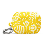 Introducing the Sol Dorado for AirPods Pro Gen 2 from Statement Cases: a yellow AirPods case adorned with a white floral and leaf pattern. This case includes a metal carabiner for easy attachment and is engineered to be impact-absorbing. The brand name "Statement Cases" is printed in small white letters at the bottom center.