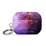 The Golden Orchid Marble for AirPods Pro Gen 2 by Statement Cases features an abstract, swirling pattern in shades of purple and gold, with "STATEMENT CASES" emblazoned on the front. It comes with a metal carabiner for easy carrying and has a premium impact-absorbing design to protect your AirPods.