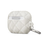 A white, quilted Quilted Delight for AirPods Pro Gen 2 with a silver keyring and metal carabiner attached on the left side. The impact-absorbing material features a diamond pattern and the words "Statement Cases" printed on the bottom front.