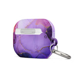 The Golden Orchid Marble for AirPods Pro Gen 2 by Statement Cases features an abstract, swirling pattern in shades of purple and gold, with "STATEMENT CASES" emblazoned on the front. It comes with a metal carabiner for easy carrying and has a premium impact-absorbing design to protect your AirPods.