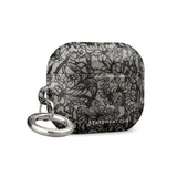 A rectangular Omerta Floral for AirPods Pro Gen 2 case with a black and white lace pattern design. The impact-absorbing case has a metal carabiner attached on the left side, and "Statement Cases" is written at the bottom.