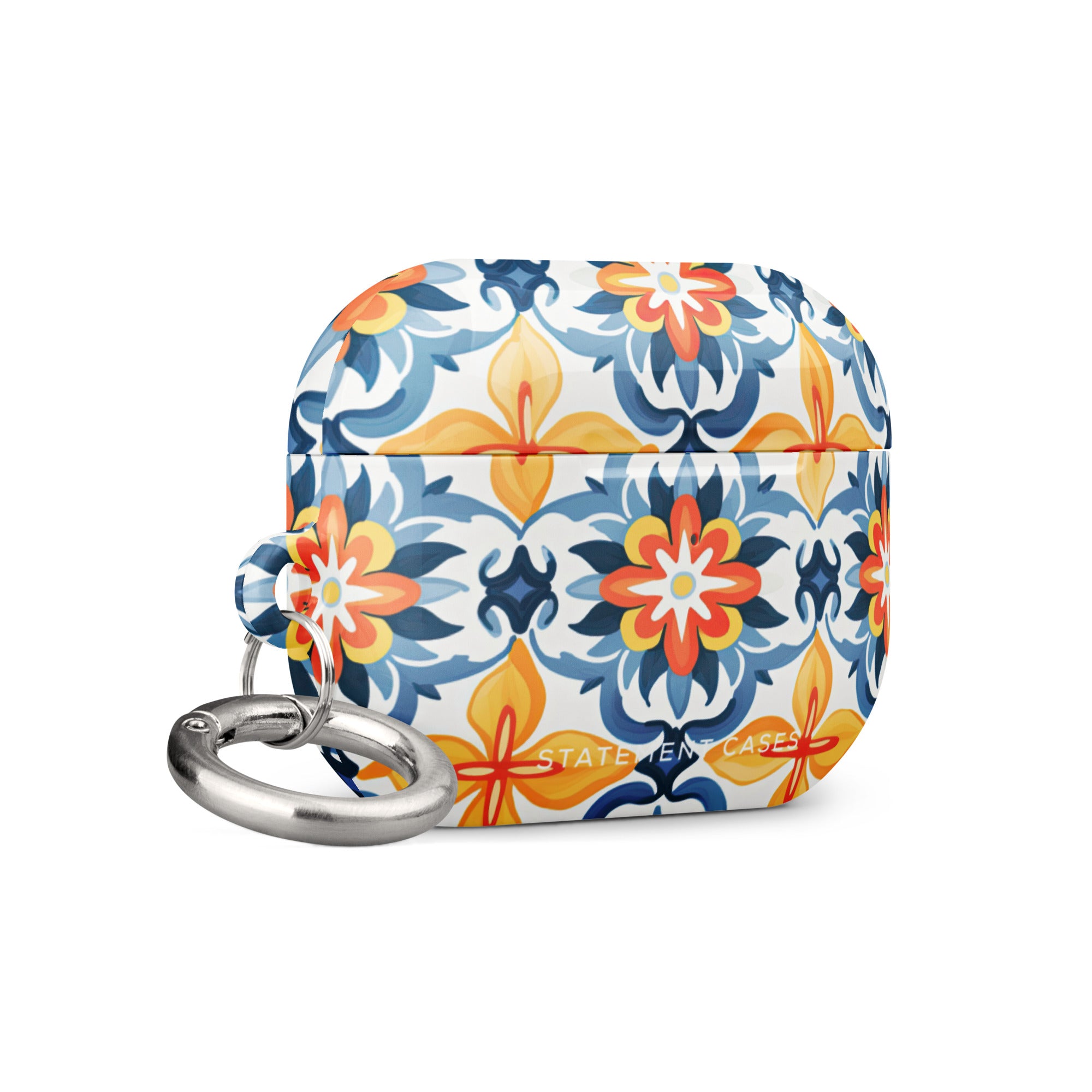 Introducing the Mediterranean Bloom for AirPods Pro Gen 2 by Statement Cases: a vibrant case adorned with a colorful, floral-like geometric pattern in blue, orange, and yellow hues. This impact-absorbing case features a metal carabiner attachment on the side, allowing it to be easily clipped to other items. The intricate design covers the entire surface of the case.