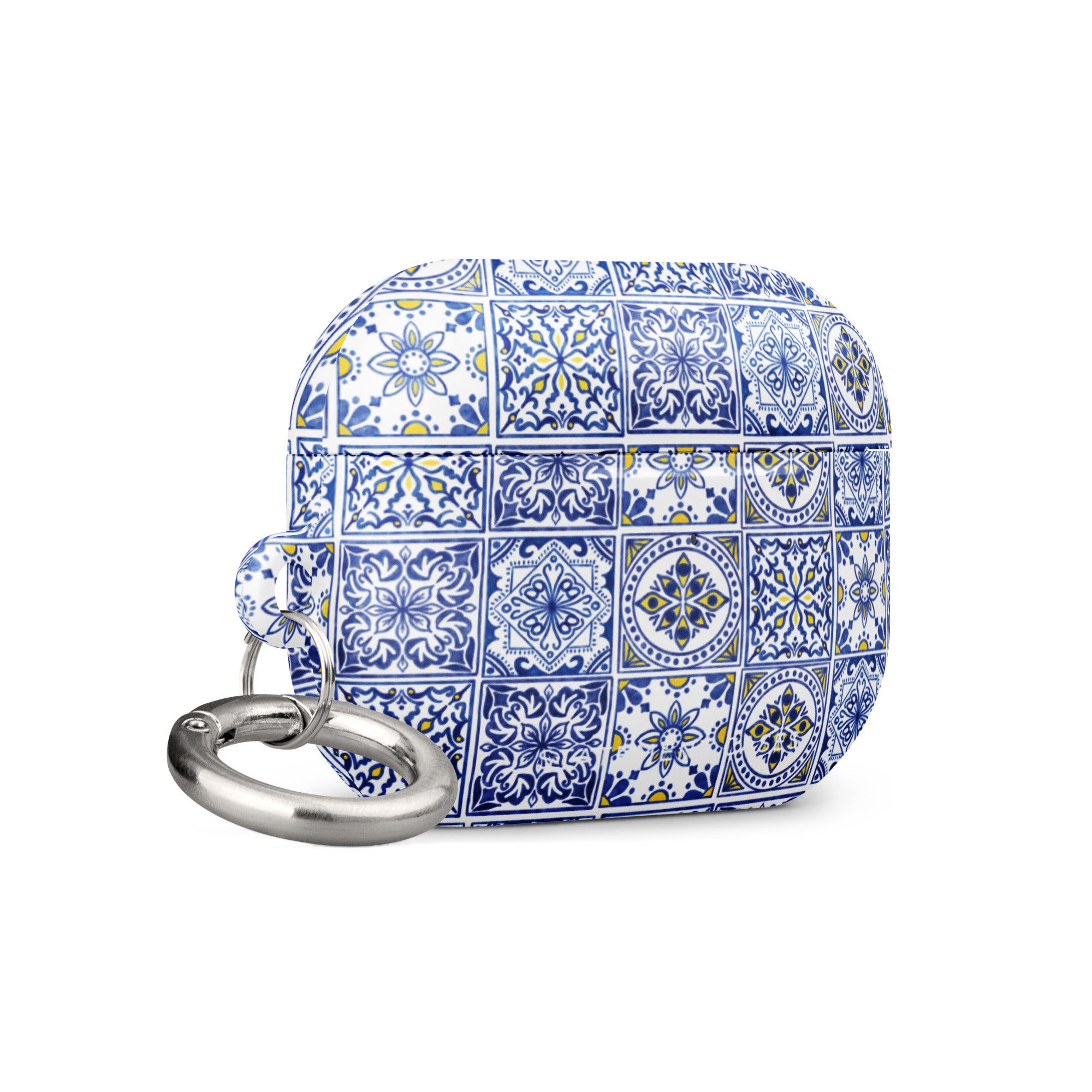 The Lisboa Azul for AirPods Pro Gen 2 by Statement Cases is a rectangular keychain pouch adorned with a blue and white tile pattern, featuring intricate floral and geometric motifs. Enhanced with impact-absorbing material, it doubles as an AirPods case. A metal carabiner is attached to the side for easy attachment to keys or other items.