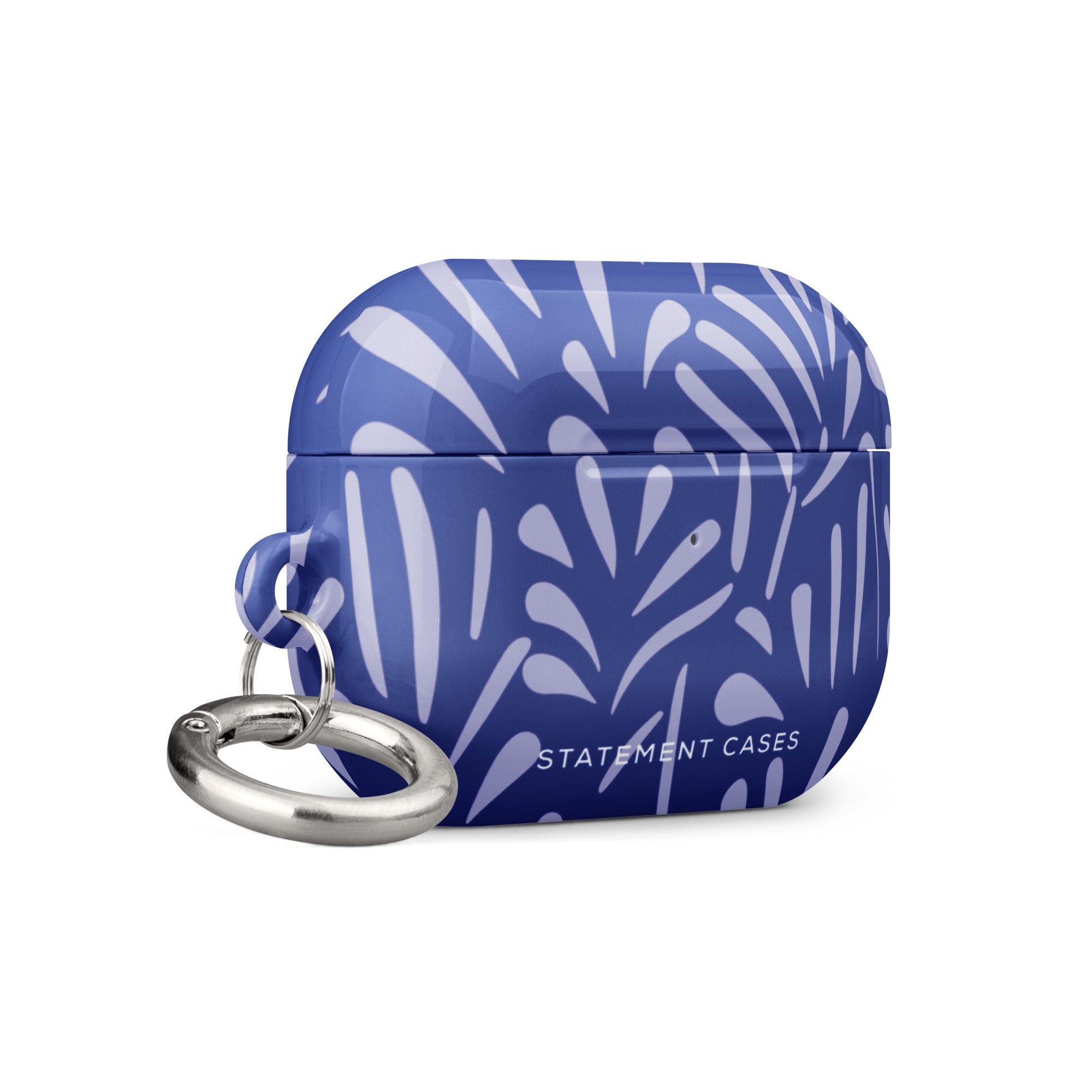 The Mariposa Azul for AirPods Pro Gen 2, designed by Statement Cases, is a blue case adorned with white abstract patterns. It features a metal carabiner attached to the left side and is crafted from impact-absorbing material. The brand name "Statement Cases" is prominently displayed at the bottom front of the case.