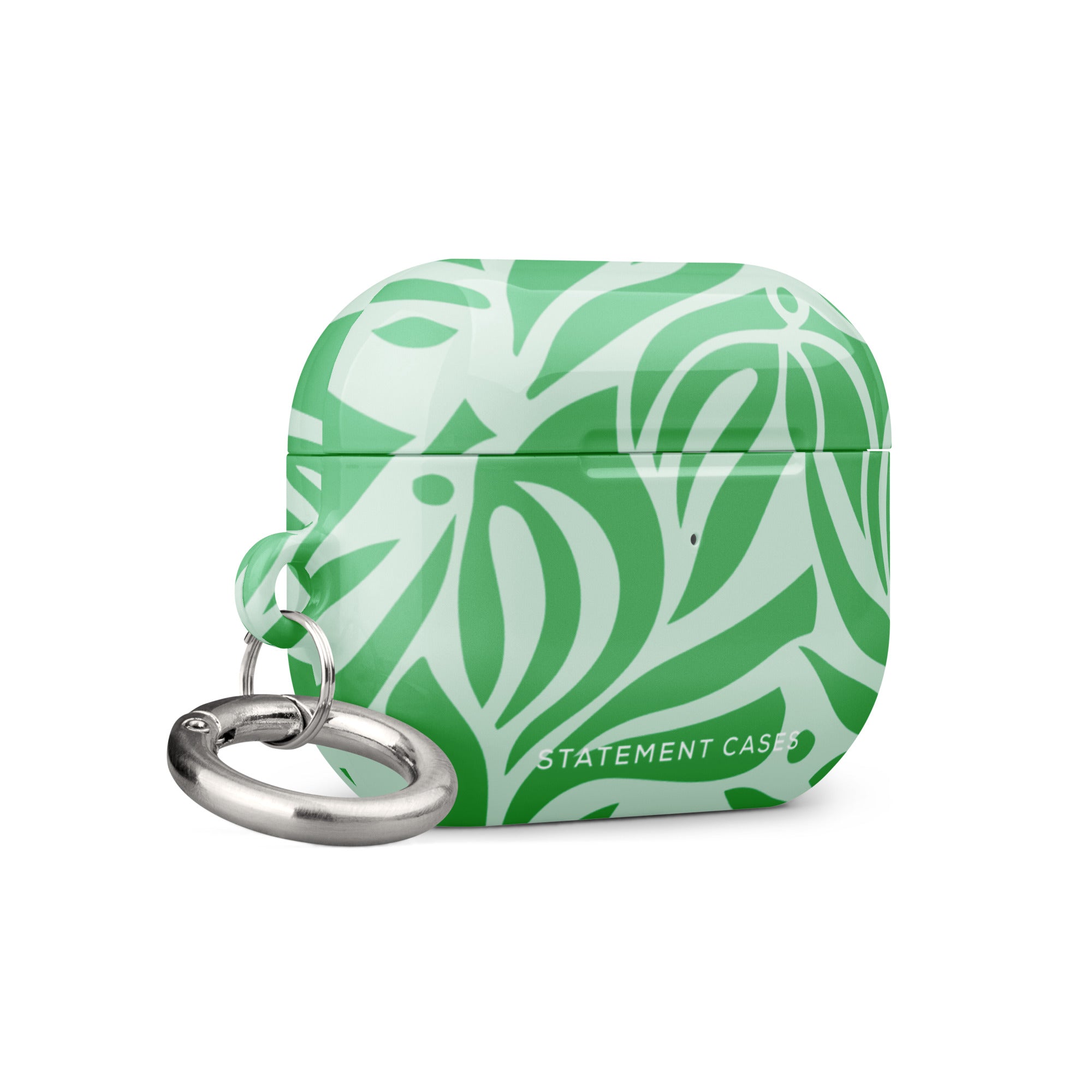 Introducing the "Selva Verde for AirPods Pro Gen 2" by Statement Cases: a green and white leaf-patterned, impact-absorbing case for your AirPods®, featuring a metal carabiner and the brand's name prominently on the front.