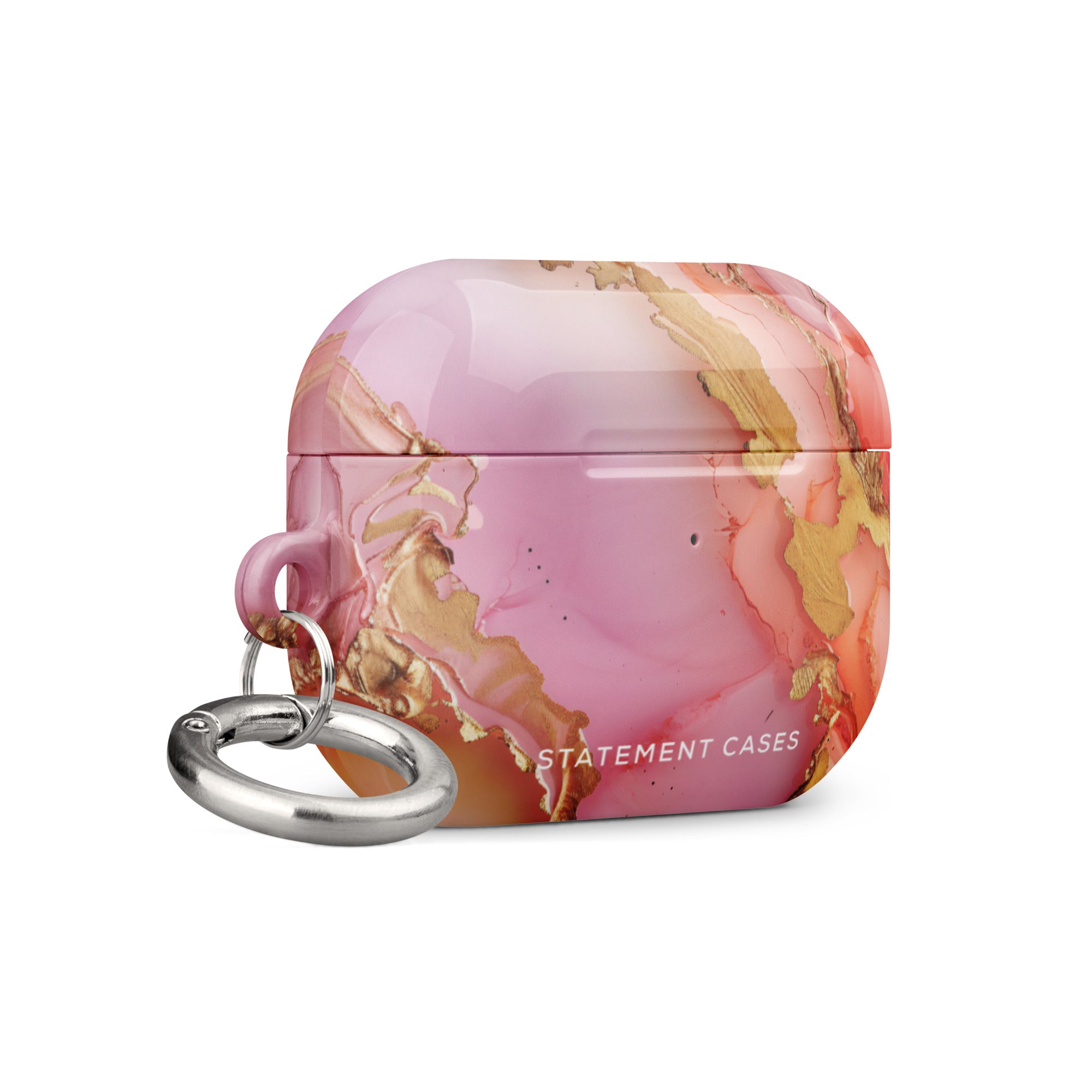 A Gold Blush Marble for AirPods Pro Gen 2 case, impact-absorbing with a pink and gold marbled pattern and a metal carabiner attached on the left side. "Statement Cases" is printed in white at the bottom front of the case.