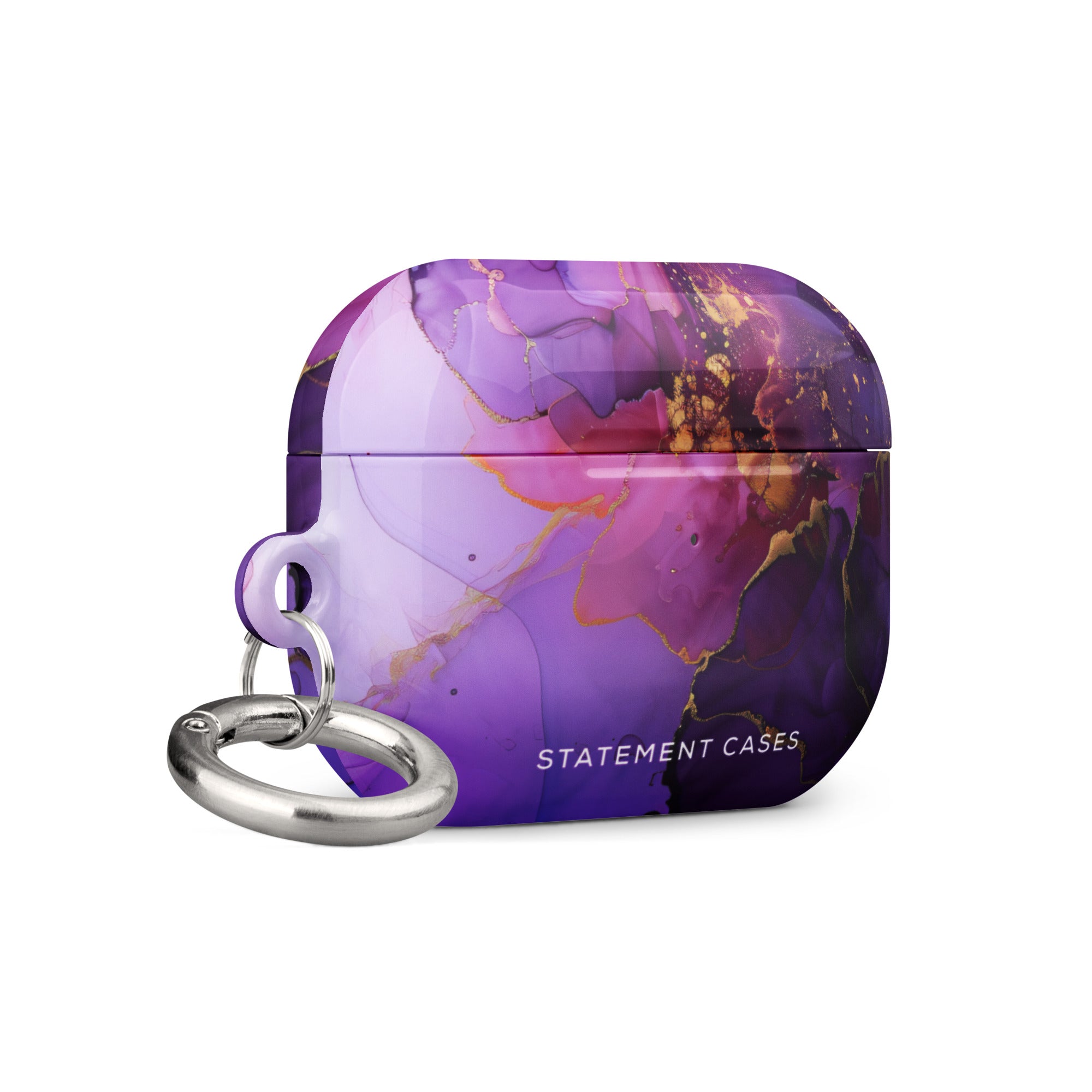 The Golden Orchid Marble for AirPods Pro Gen 2 by Statement Cases features an abstract, swirling pattern in shades of purple and gold, with "STATEMENT CASES" emblazoned on the front. It comes with a metal carabiner for easy carrying and has a premium impact-absorbing design to protect your AirPods.