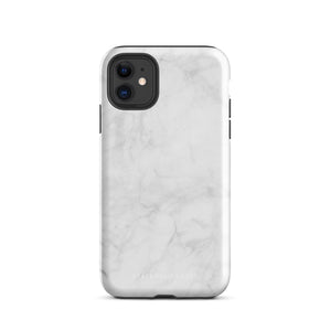 A protective iPhone case with a white marble-patterned design featuring three camera lenses and a flash. The marble pattern on this Marble Dreams for iPhone 15 Pro Max case is subtle, with light gray veining. The brand "Statement Cases" is subtly engraved at the bottom of the case.