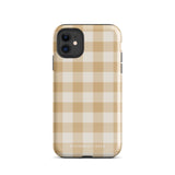 A Gingham Grace for iPhone by Statement Cases is covered with a protective case featuring a beige and white checkered pattern. The case's design includes a matte finish, dual-layer protection with an impact-resistant polycarbonate exterior and TPU lining, and the text "Statement Cases" printed near the bottom. The phone's cameras and buttons are visible.