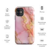 The Gold Blush Marble for iPhone showcases a glossy, marble-patterned case in shades of pink and gold. The decorative design features swirling patterns, seamlessly blending the colors. Crafted with impact-resistant polycarbonate for superior phone protection, "Statement Cases" is written in white at the bottom.