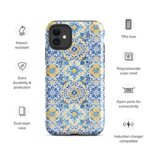 The Blue Mirage for iPhone by Statement Cases features a dual-layered, impact-resistant polycarbonate exterior with a TPU inner liner. Inspired by traditional Portuguese tiles, the blue and yellow patterned case boasts an intricate design of floral and geometric motifs. With its elegant and colorful appearance, the phone's camera is visible at the top left of the case.