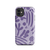 The Luna Morada for iPhone by Statement Cases is a durable phone case with a purple protective exterior featuring abstract dark purple and lavender patterns. The design includes geometric shapes and curves, giving it a modern artistic look. Made from impact-resistant polycarbonate, the lower part of the case prominently displays "STATEMENT CASES.