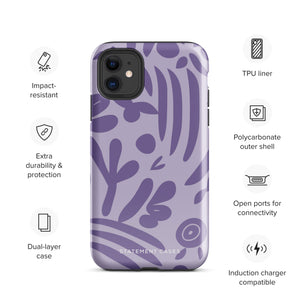 The Luna Morada for iPhone by Statement Cases is a durable phone case with a purple protective exterior featuring abstract dark purple and lavender patterns. The design includes geometric shapes and curves, giving it a modern artistic look. Made from impact-resistant polycarbonate, the lower part of the case prominently displays "STATEMENT CASES.