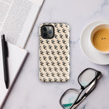 A beige protective iPhone case with an interlocking black "SC" pattern displayed across its back. Custom-tailored for the iPhone 15 Pro Max, the Heritage Monogram for iPhone by Statement Cases features cutouts for the camera lenses and buttons. The design is sleek and minimalistic.