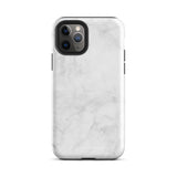 A protective iPhone case with a white marble-patterned design featuring three camera lenses and a flash. The marble pattern on this Marble Dreams for iPhone 15 Pro Max case is subtle, with light gray veining. The brand "Statement Cases" is subtly engraved at the bottom of the case.