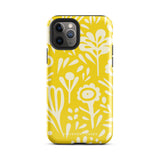 The Sol Dorado for iPhone by Statement Cases is a smartphone with a yellow case featuring a white, abstract floral and plant pattern. The camera lenses are prominent in the top left corner of the device. With dual-layer protection and impact-resistant TPU lining, "Statement Cases" is printed at the bottom of the case.