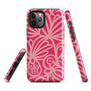 Introducing the Zafiro Rosa for iPhone by Statement Cases: a smartphone case featuring abstract floral and leaf patterns in various shades of pink. This dual-layer protection case combines an impact-resistant polycarbonate exterior with a TPU inner liner to ensure durability. The design showcases the brand name "Statement Cases" at the bottom, with precise cutouts revealing the phone’s camera lenses at the top left corner.