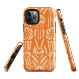 A Savannah Ardiente for iPhone from Statement Cases, featuring a dual-layered phone case in orange with a floral pattern showcasing cream-colored flowers, leaves, and geometric shapes. This impact-resistant polycarbonate case displays "STATEMENT CASES" at the bottom and reveals the camera lenses at the top left corner.