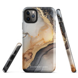 A smartphone with a sleek, marbled design case featuring swirls of gold, beige, and dark grey colors. The camera lenses on the back of the iPhone 15 Pro Max are clearly visible, and the protective Lunar & Gold Marble for iPhone case is branded with "Statement Cases" at the bottom.