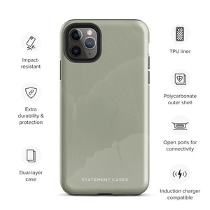 A sleek pale green Pistachio Haze for iPhone case with a subtle floral pattern on the back. Designed for the iPhone 15 Pro Max, it has precise cutouts for the camera lenses and features the brand name "Statement Cases" in white text at the bottom.